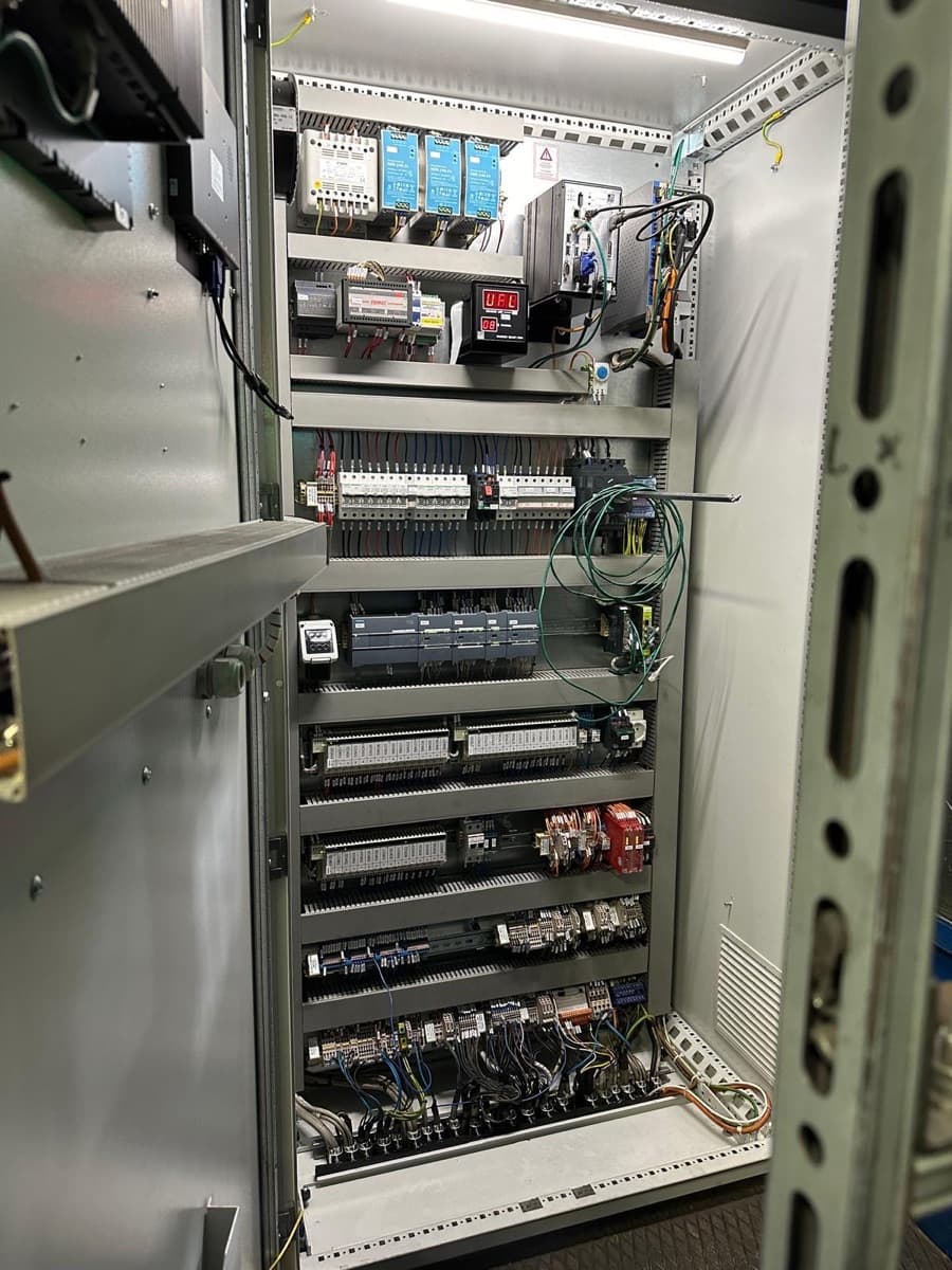 The open cabinet of a modern CIME IGBT converter, with neatly mounted modular components on DIN rails and tidy wiring